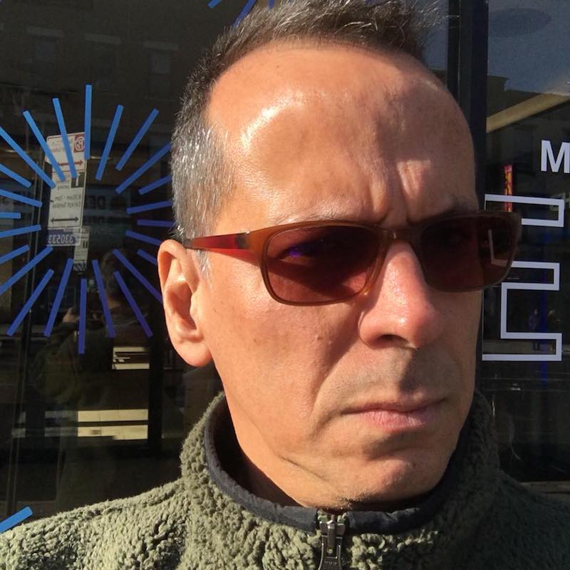 An informal headshot of Fernando Maneca wearing sunglasses
