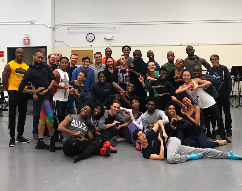 The entire Ailey company pose for a group shot after rehearsal