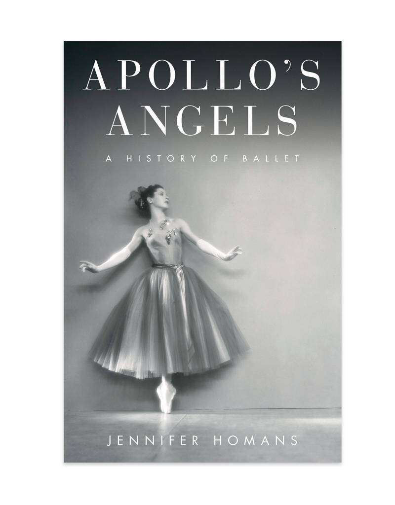 The book jacket for Apollo's Angels. A ballerina is on pointe with her arms outstretched. Her full tutu grazes her ankles.