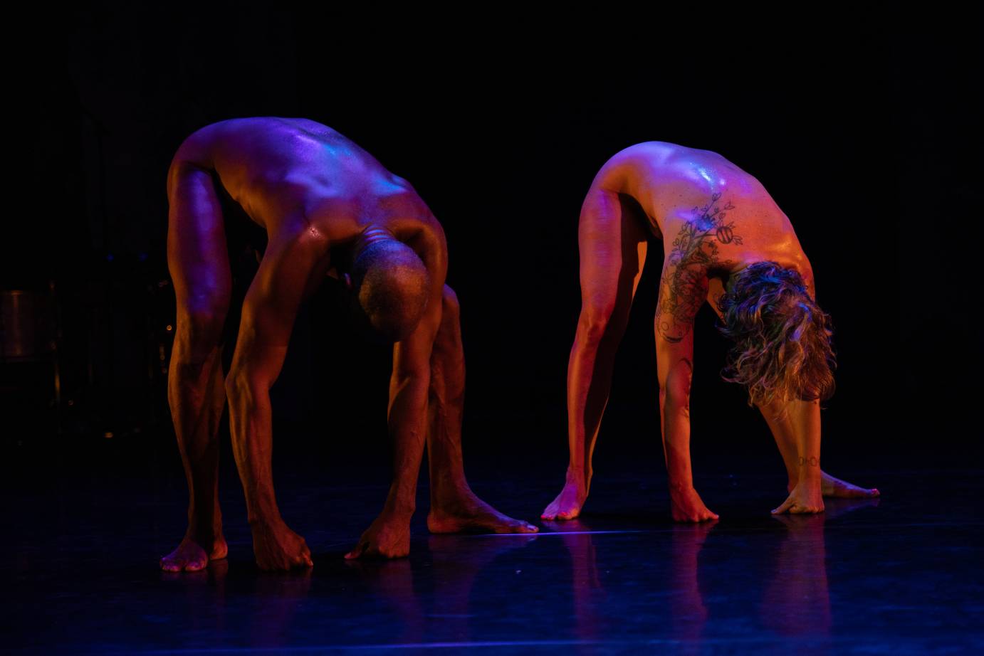 2 naked dancers bent over