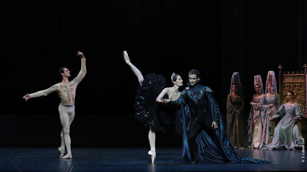 Odile penchees with von Rothbart as Prince Siegfried assumes a classical tendu derriere