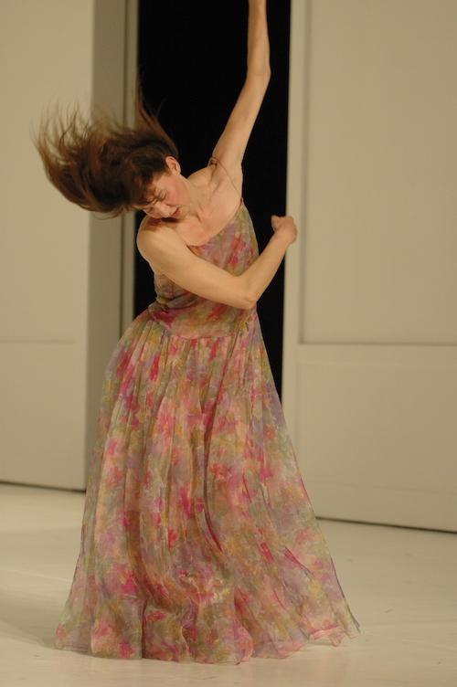 Helena Pikon swipes her arms through the air. Her hair cascades around her head in response.