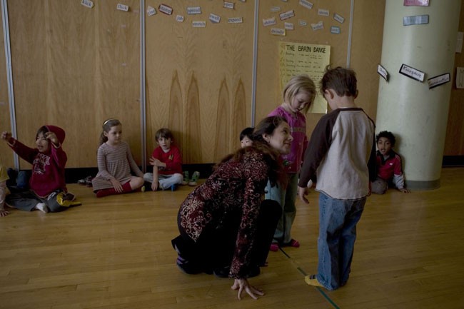 8:30 amCatherine leads Kindergarten Partners - (the seated students accompany the moving ones with hand gestures)