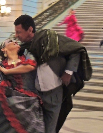 Dancers of La Tunante perform inside City Hall