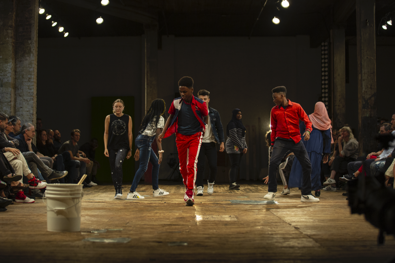 Eight teens in sneakers walk