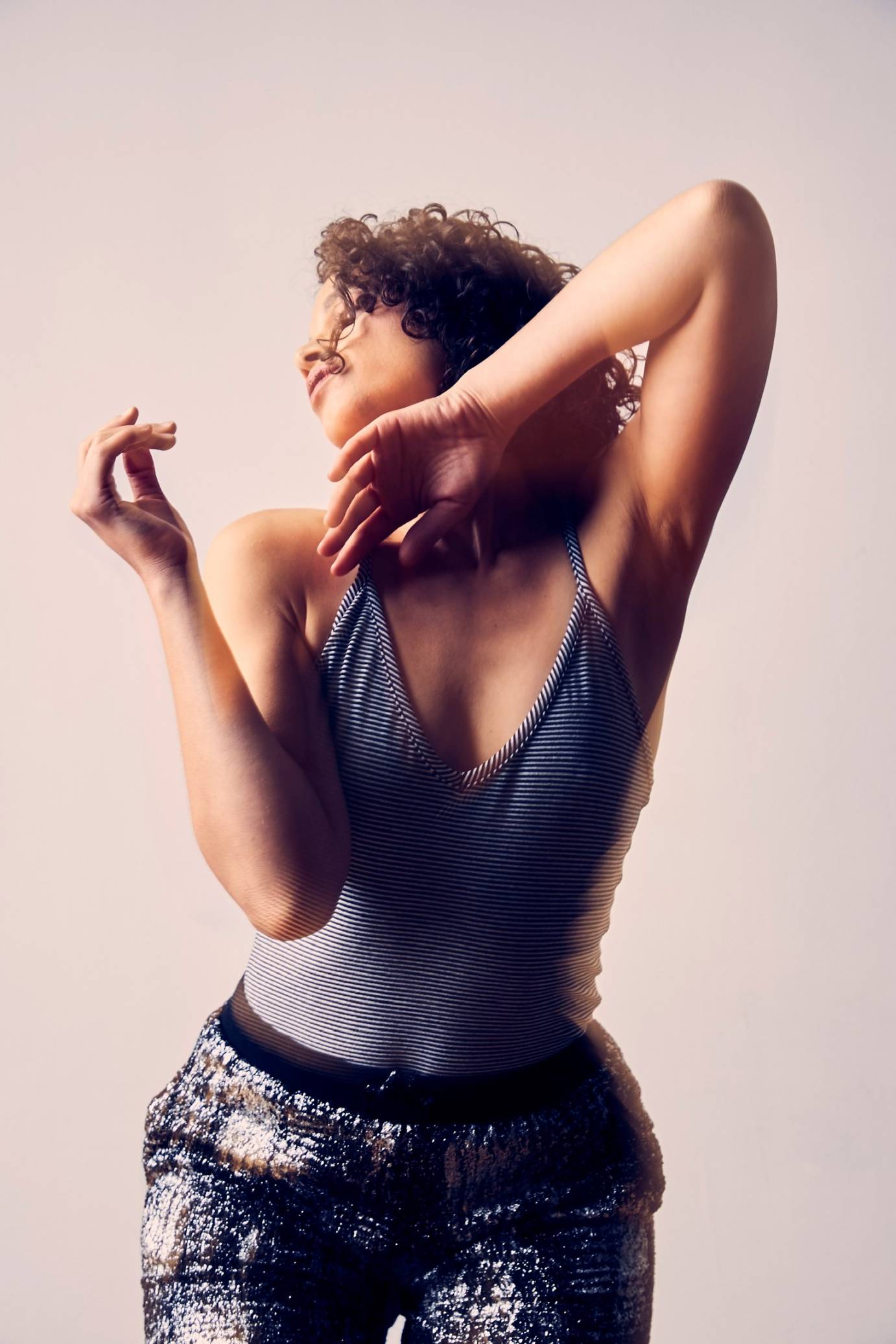 Woman in tank top looks blissful