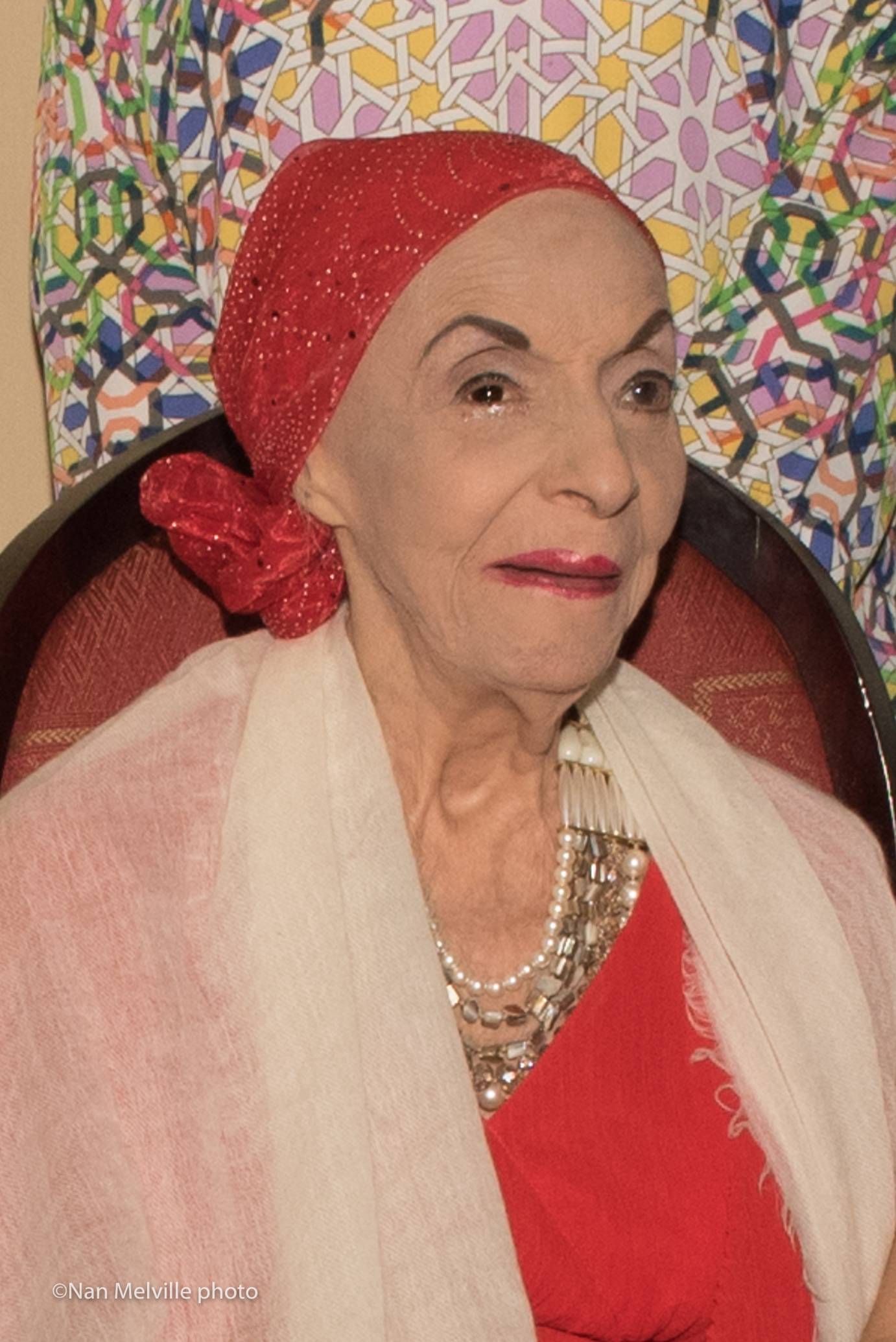 Alicia Alonso in a red head scarf