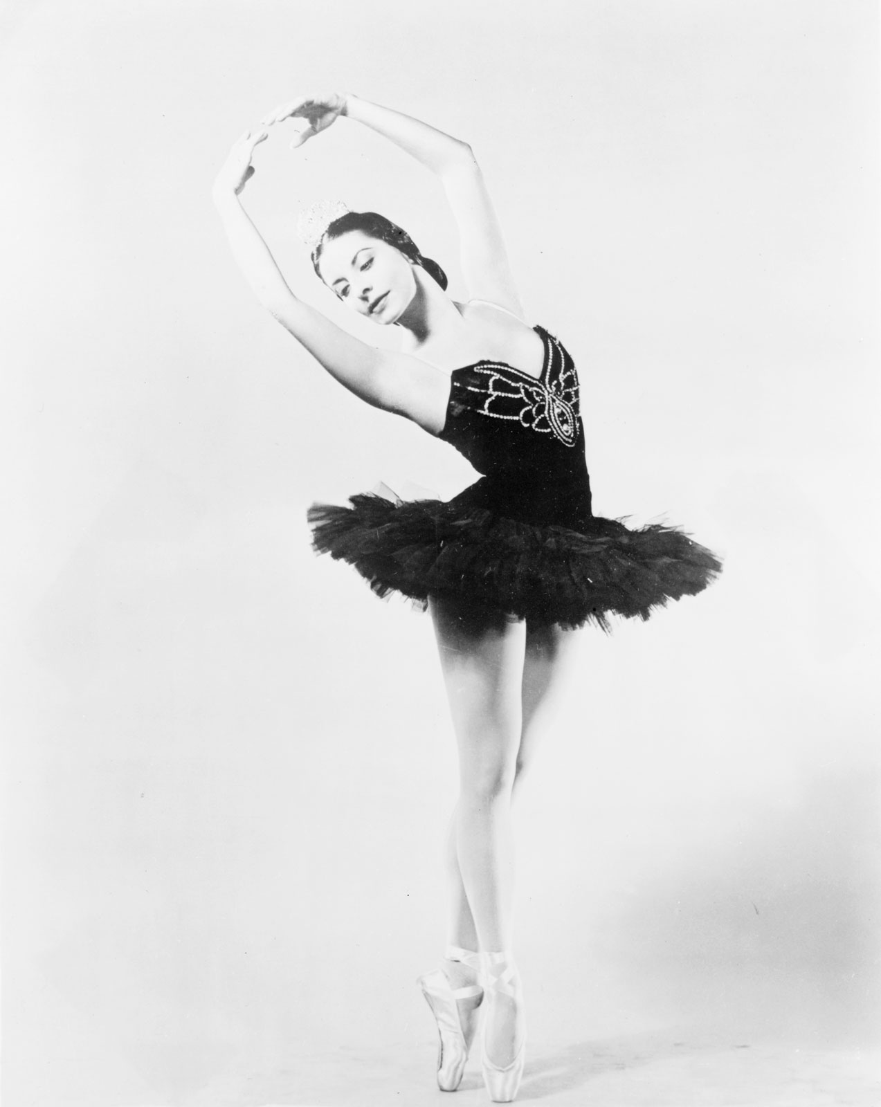 Alicia Alonso as a young ballerina in a black tutu