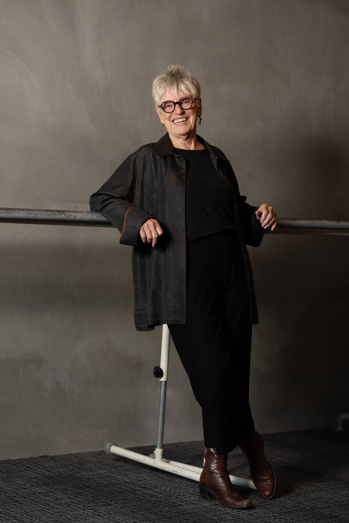 brenda way with a breezy smile leans against a barre in her dance studio... 