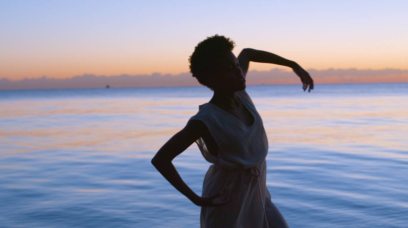 Paige Fraser moves in front of the lake at Sunrise