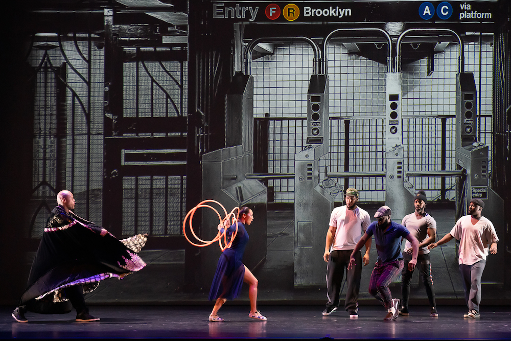 street dancers meet an native American hoop dancer in the Brooklyn subway station