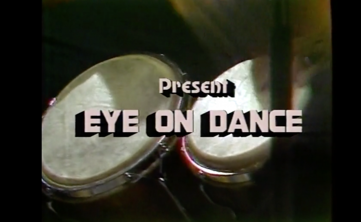 Still shot of rolling credits for EYE ON Dance program, bongo drums white topped bongo drums with caption EYE ON DANCE in light pink 