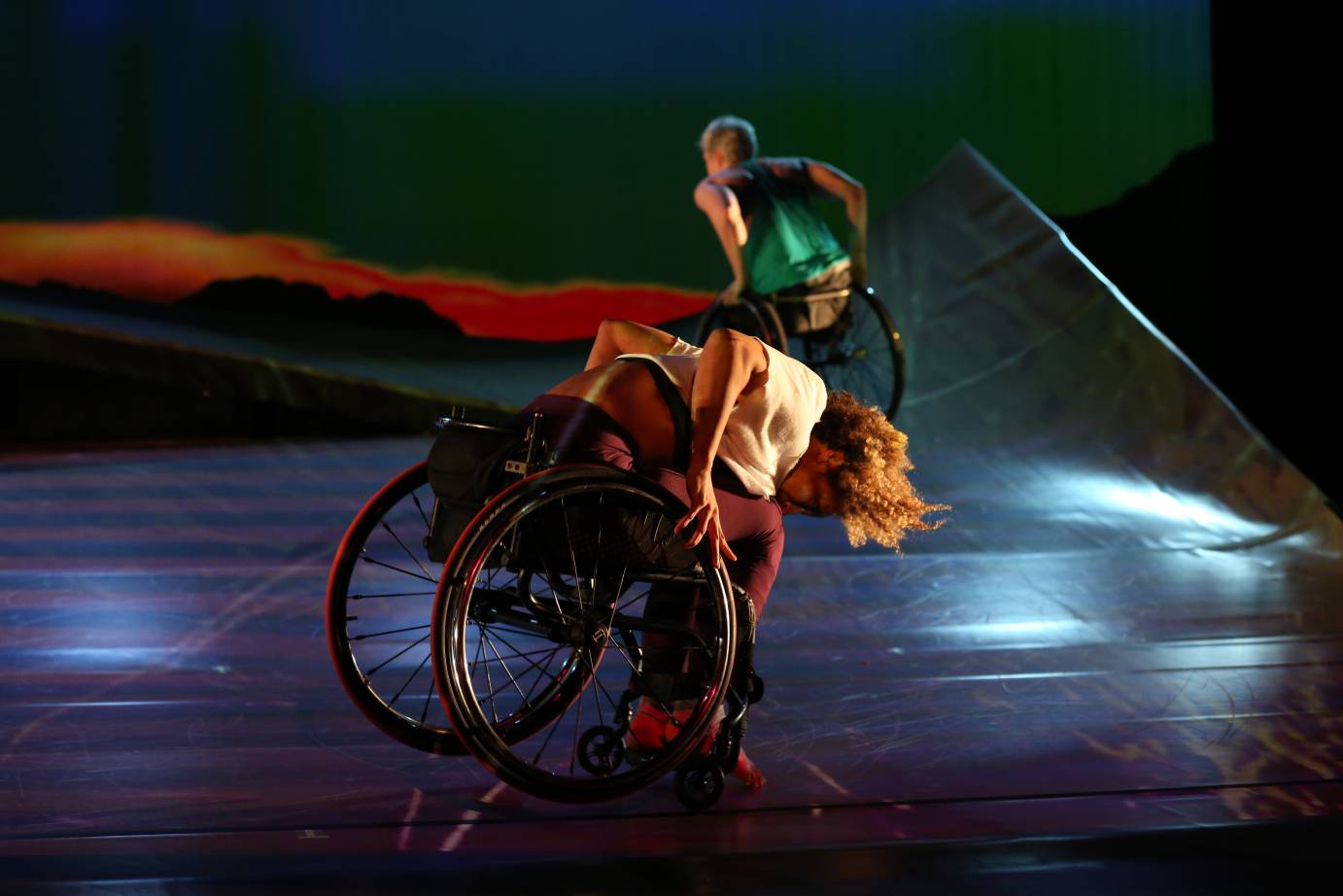 Alice and Lauren Wheeling uphill on ramp with joy