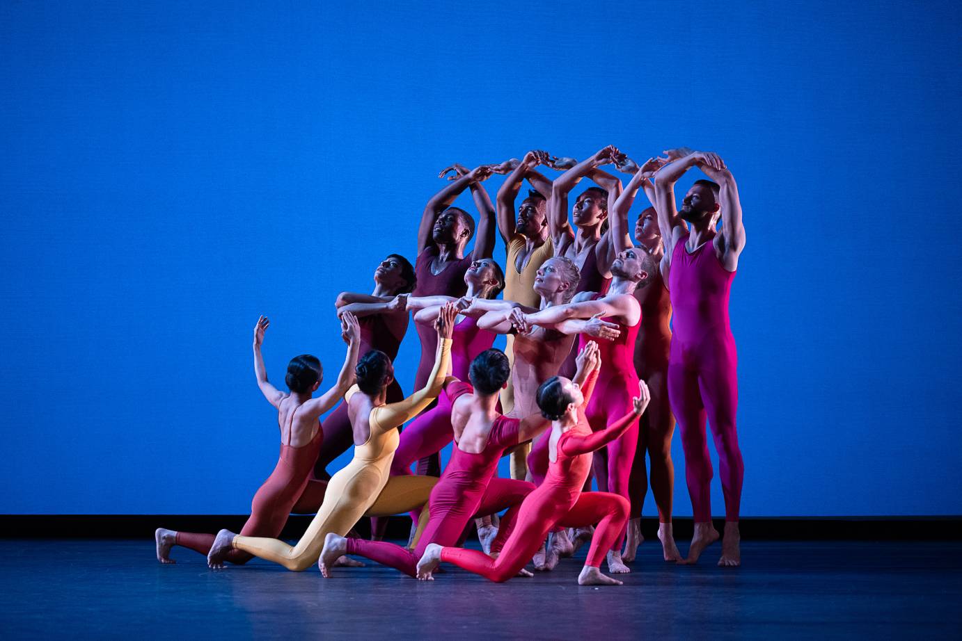 a chorus of Limon dancers in candy colored unitards form a sculpture that moves from the floor upward... sweeping stillness