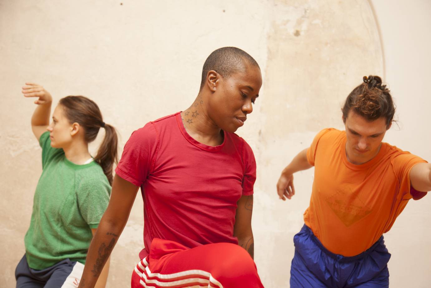 Three dancers in sculptural poses