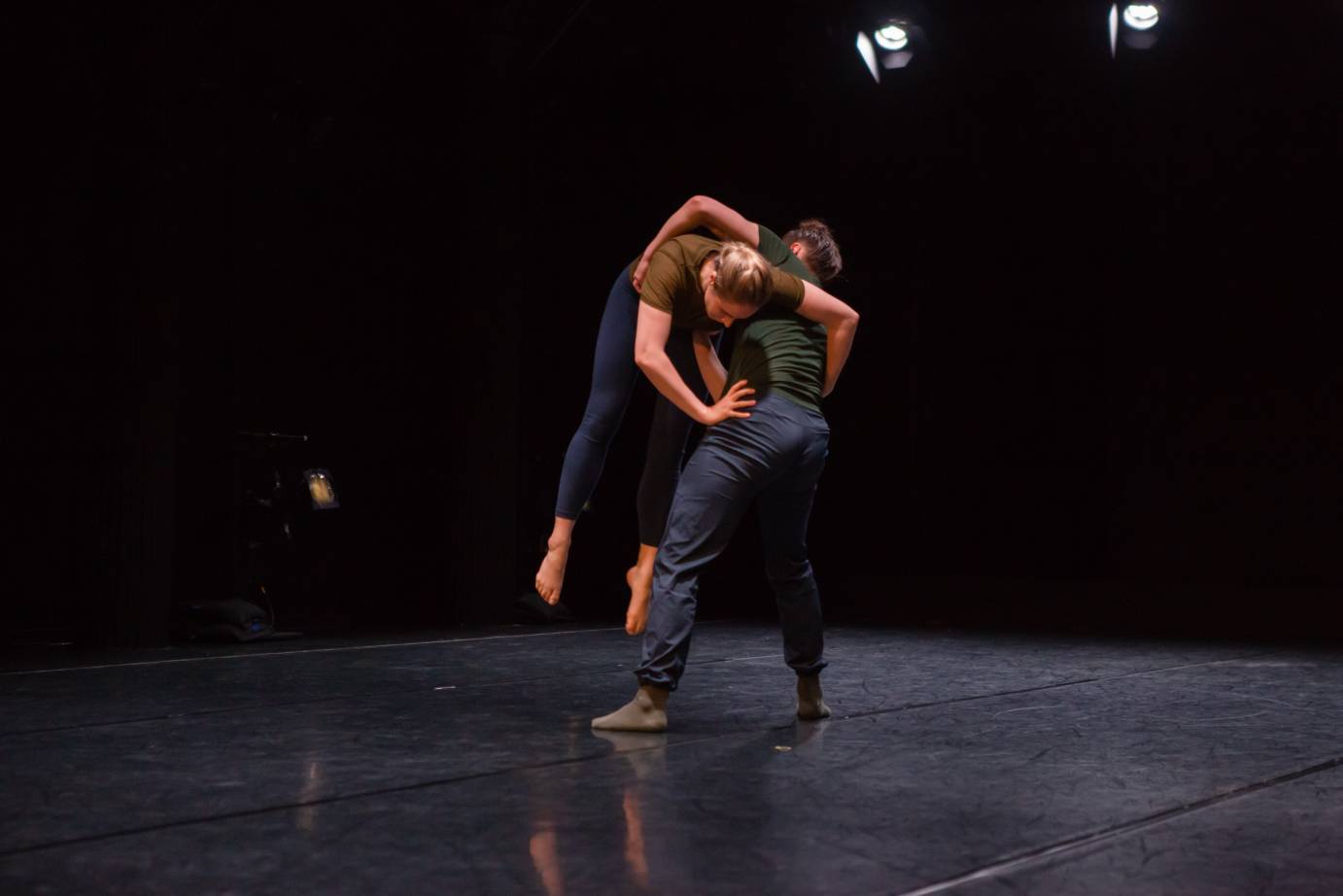 A man holds a woman who is jumping in the air