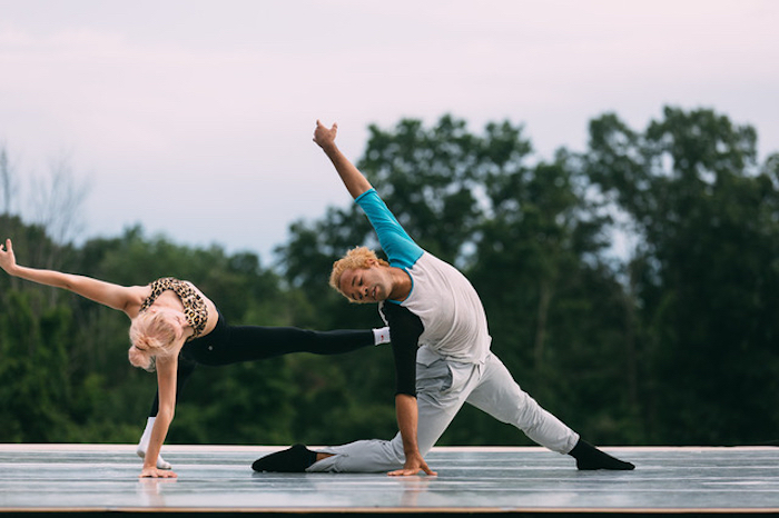 Two dancers in jazzy 80s lunges