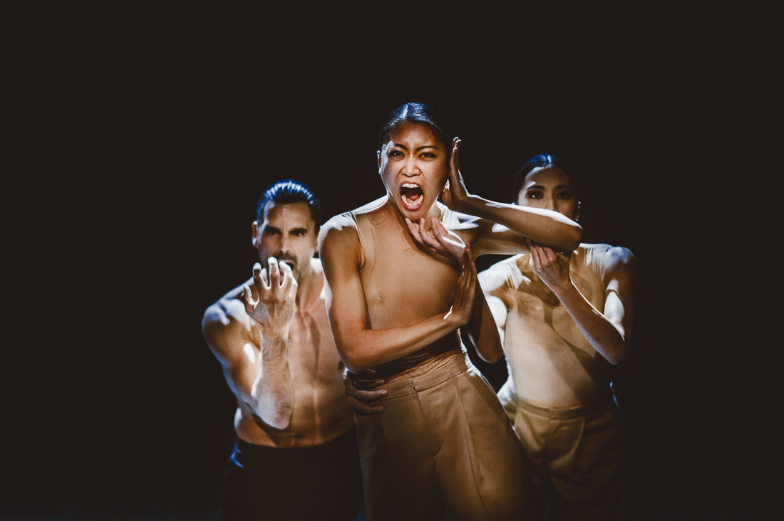 Two women and one man make faces while gesturing