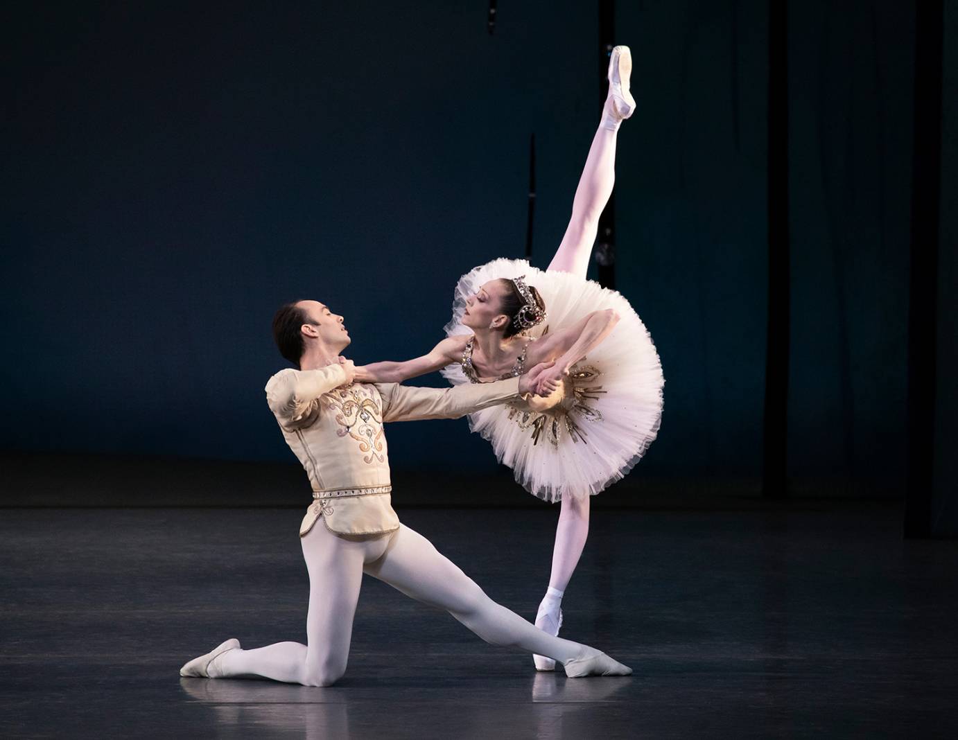 Tyler Angle partners Maria Kowroski, who's in a deep arabesque