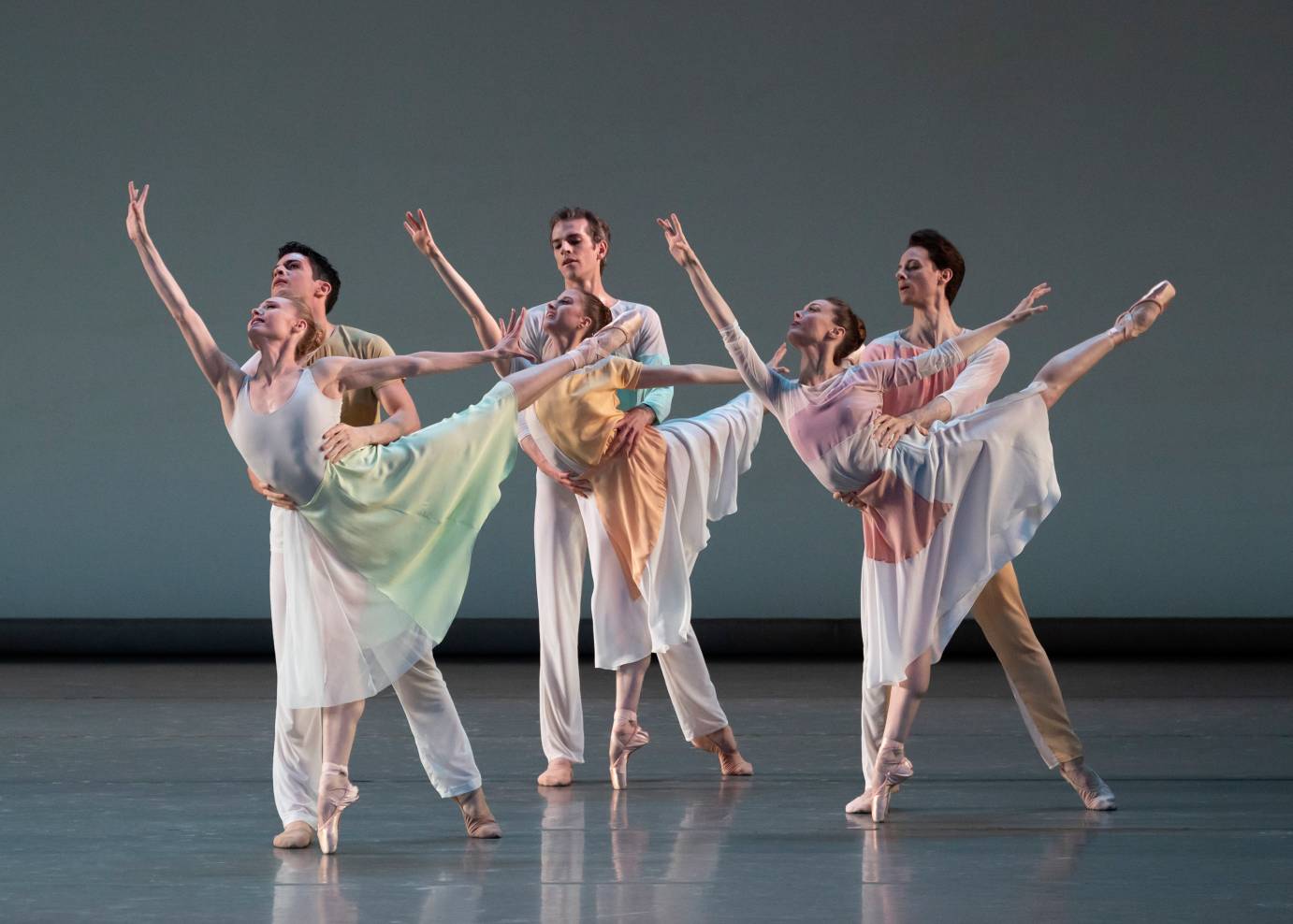 Three couples with the women in arabesque as the men partner them