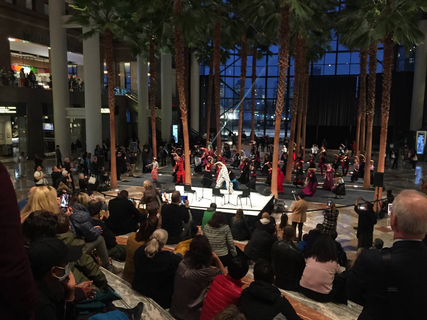 A god's eye view of the flamenco flash mob with dancers arching to the side