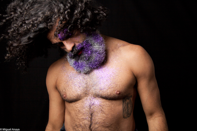 Antonio Ramos swings his curly hair. His beard is full of purple glitter.