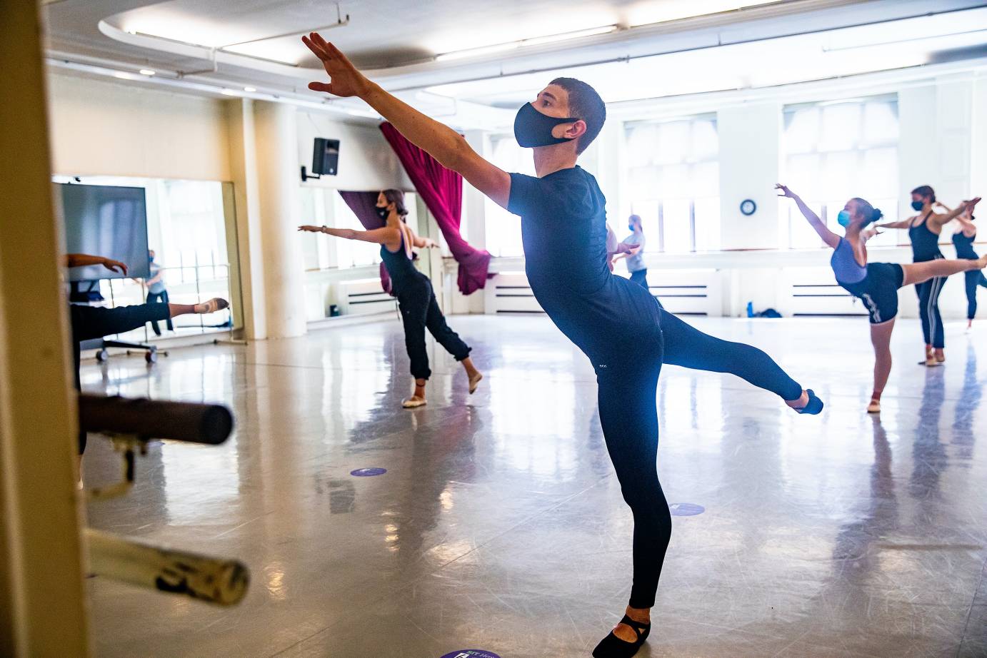 Students at Tisch in center, doing an arabesque