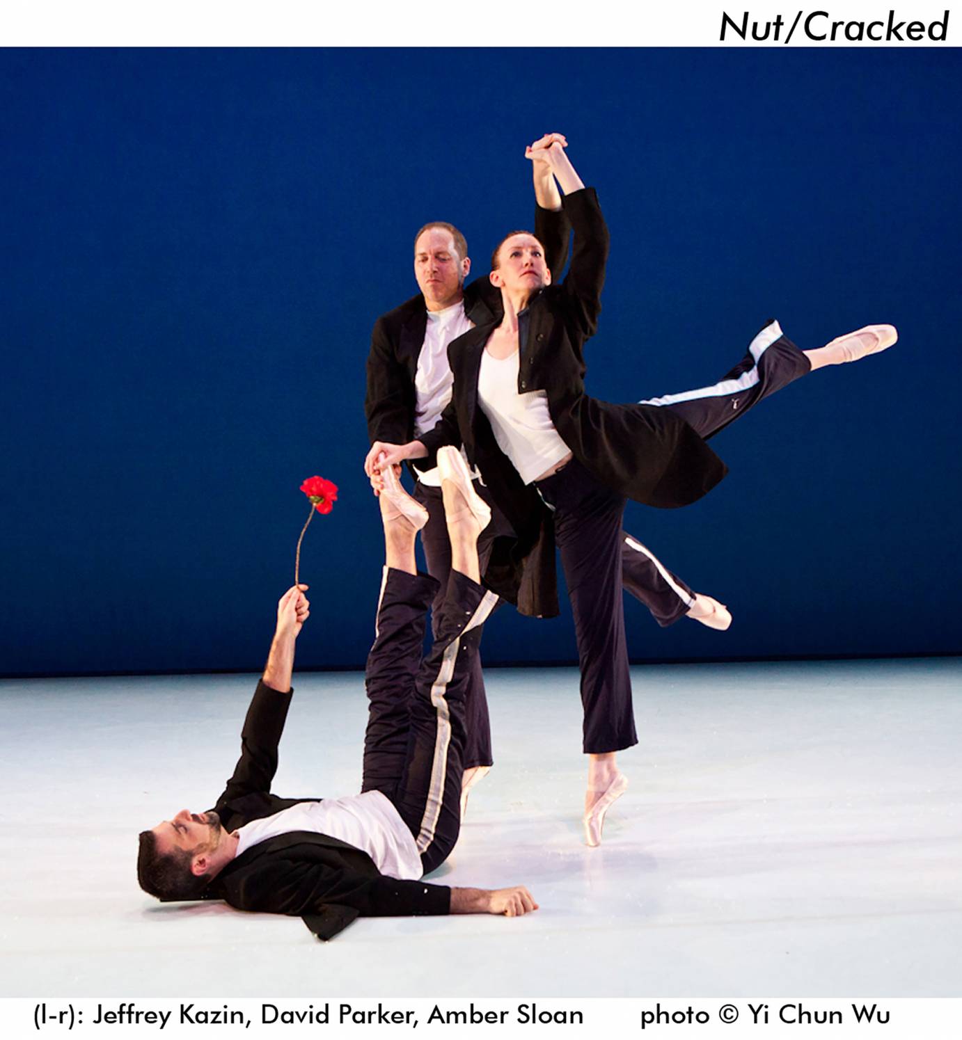 David Parker partners a woman in arabesque as Jeffrey Kazin offers rose while lying on the ground