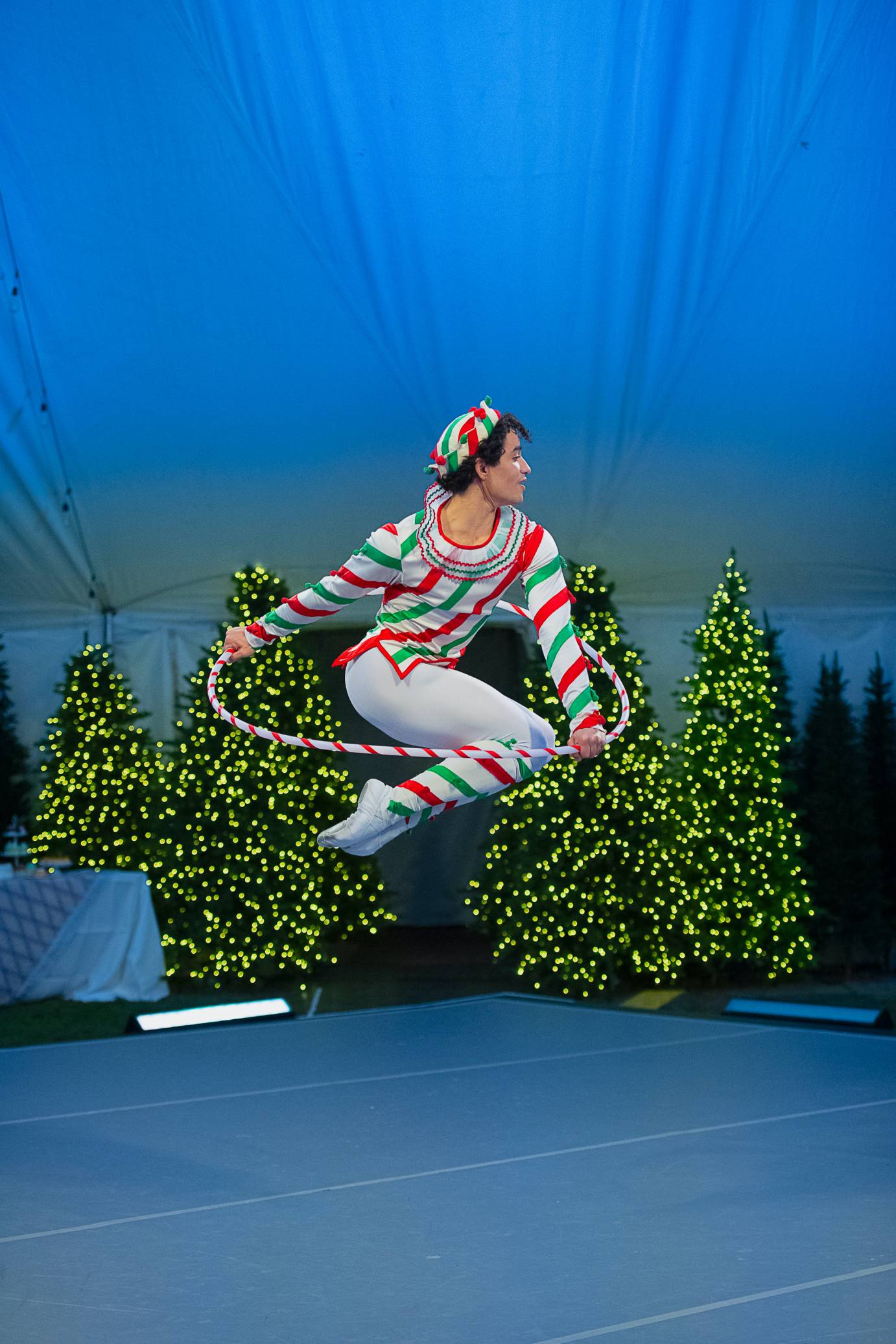 In Candy Cane, a man jumps through a hoop