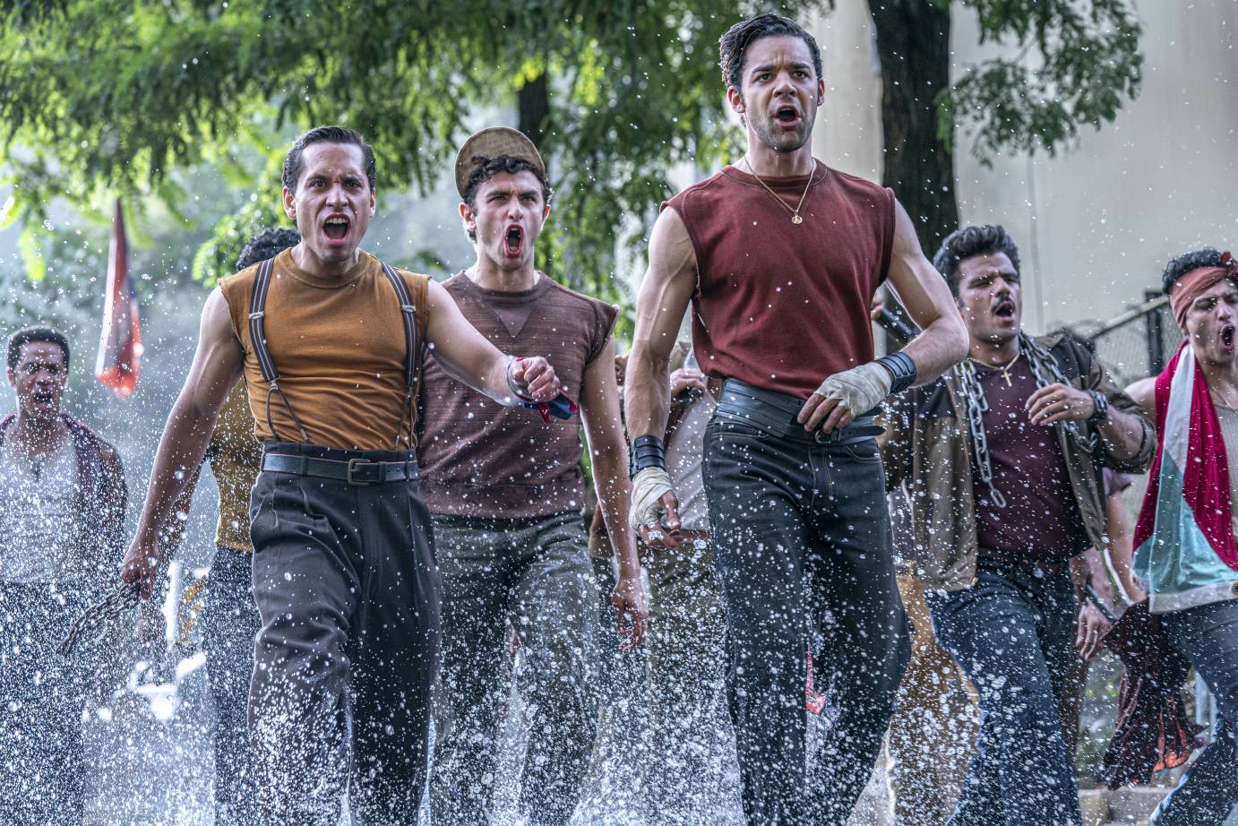 a chorus of singing men ready for a fight forefully walking through splashing water