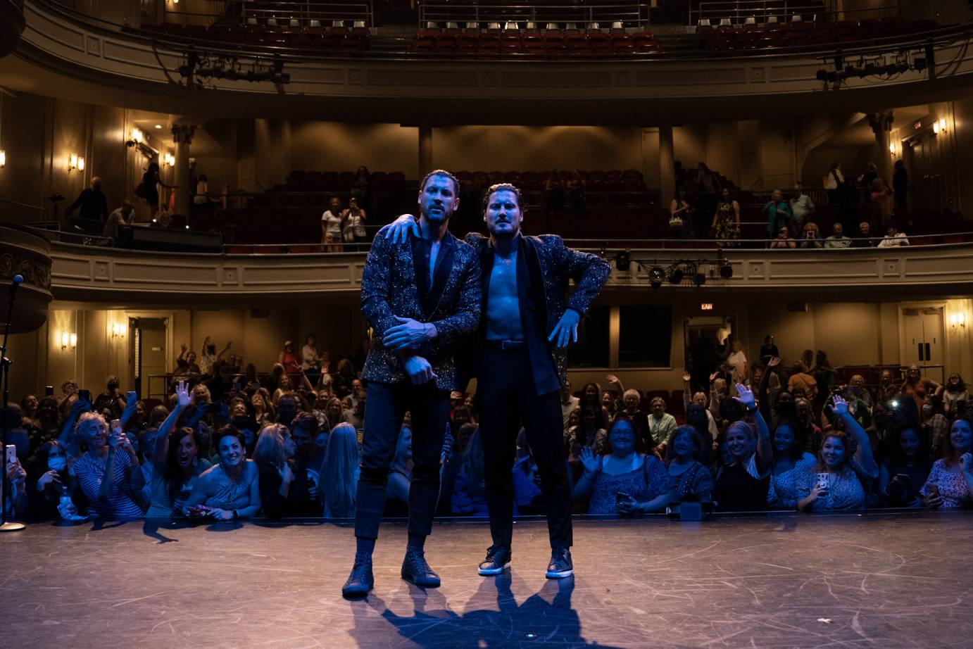 Maks and Val Chmerkovskiy hug each other onstage of NJPAC